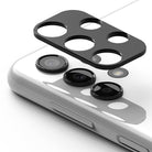 Galaxy A13 4G (LTE) | Camera Styling - Black protective camera lens cover hovering above a white smartphone's rear lenses.