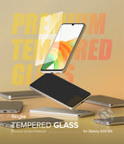 Galaxy A33 5G Screen Protector [2P] | Invisible Defender - Galaxy A33 5G Screen Protector - Tempered glass screen protector hovering above a Galaxy A33 5G smartphone on a desk.