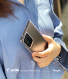 Galaxy Note 20 Ultra Case | Fusion Matte - A hand holds a Galaxy Note 20 Ultra in a clear matte case against a blue shirt.
