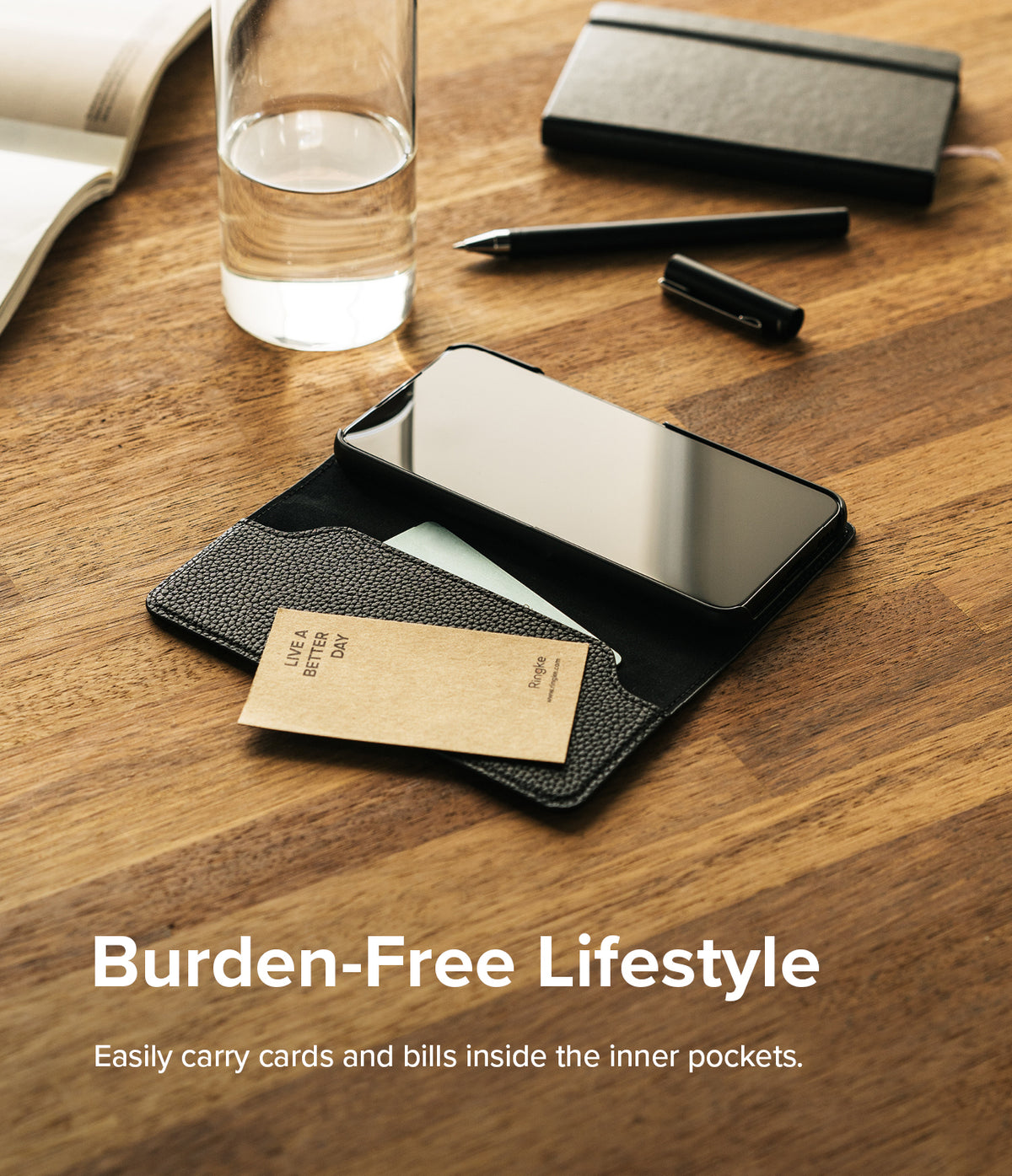 Galaxy S22 Case | Folio Signature Standard - Black leather folio phone case with card slots on a wooden desk.