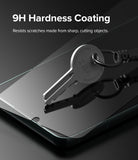 Galaxy S22 Plus Screen Protector | Invisible Defender Glass [2P] - Galaxy S22 Plus Screen Protector - A metal key rests on a glass screen protector, demonstrating 9H scratch resistance.