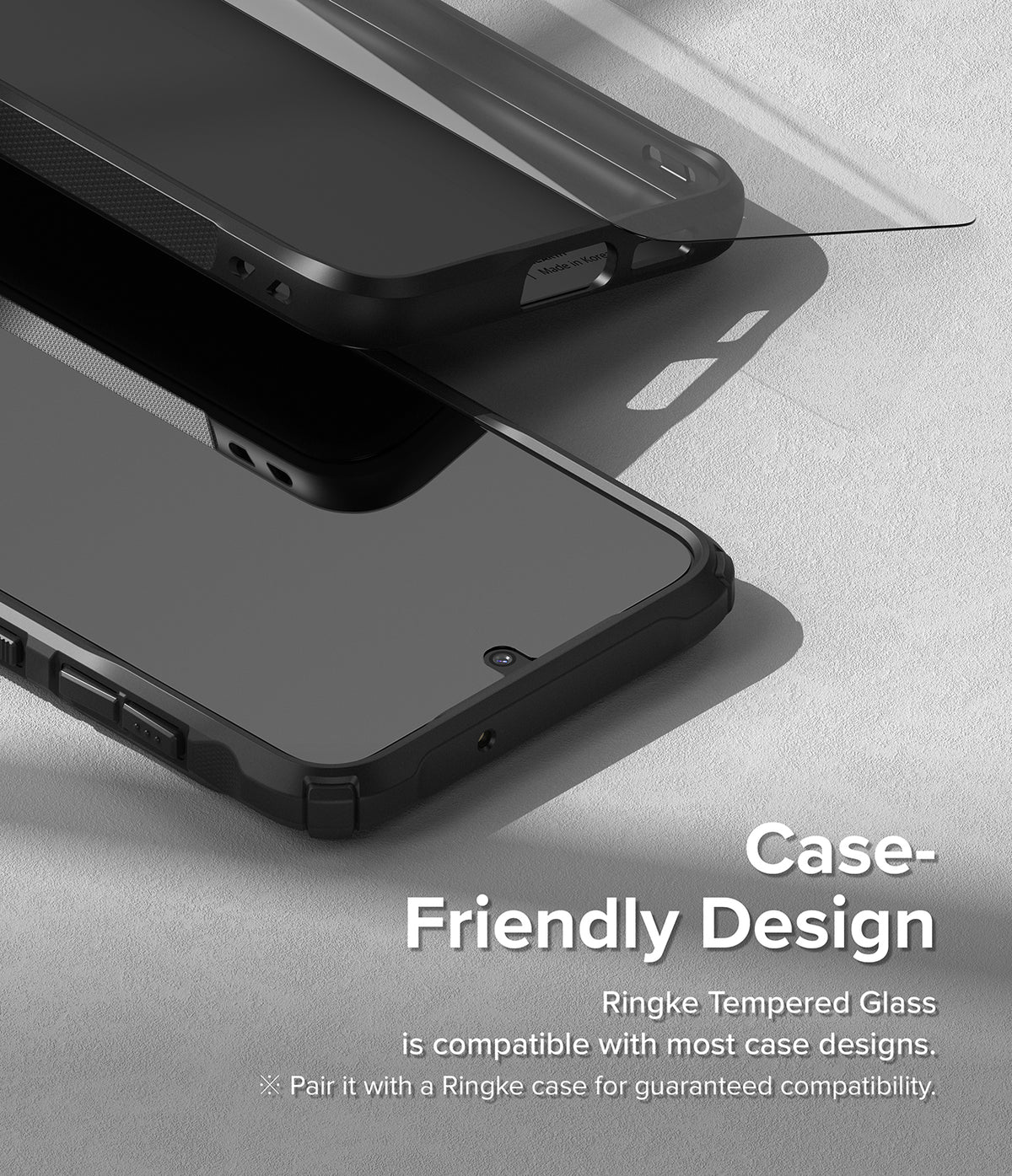 Galaxy S23 Plus Screen Protector | Full Cover Glass - Galaxy S23 Plus Screen Protector - Tempered glass being applied to a smartphone inside a black protective case.