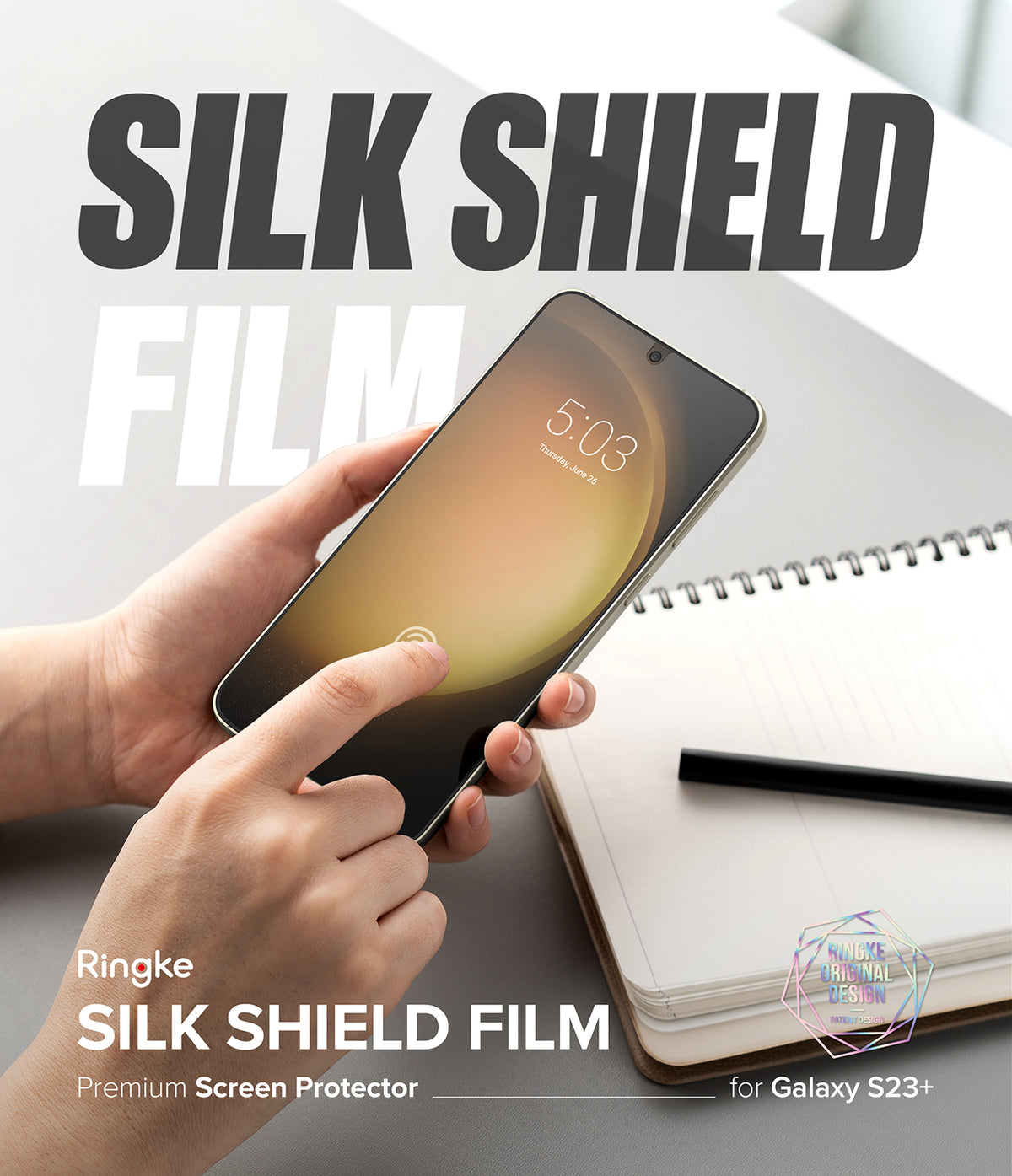 Galaxy S23 Plus Screen Protector | Silk Shield Film [2 Pack] - Galaxy S23 Plus Screen Protector - Hands holding a phone with a screen protector applied, next to a notebook and pen.