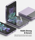 Galaxy Z Flip 3 Screen Protector - Transparent film being applied to a purple folding smartphone screen.
