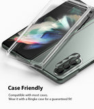 Galaxy Z Fold 3 | Camera Styling - A black camera lens protector hovering over the triple-lens array of a green Galaxy Z Fold 3.