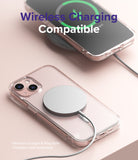 iPhone 13 Mini Case | Fusion Magnetic - iPhone 13 Mini in a clear case with a magnetic charger attached on a pink surface.