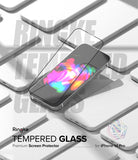iPhone 14 Pro Screen Protector | Full Cover Glass - iPhone 14 Pro Screen Protector - Tempered glass sheet hovering over an iPhone 14 Pro with a colorful abstract screen.