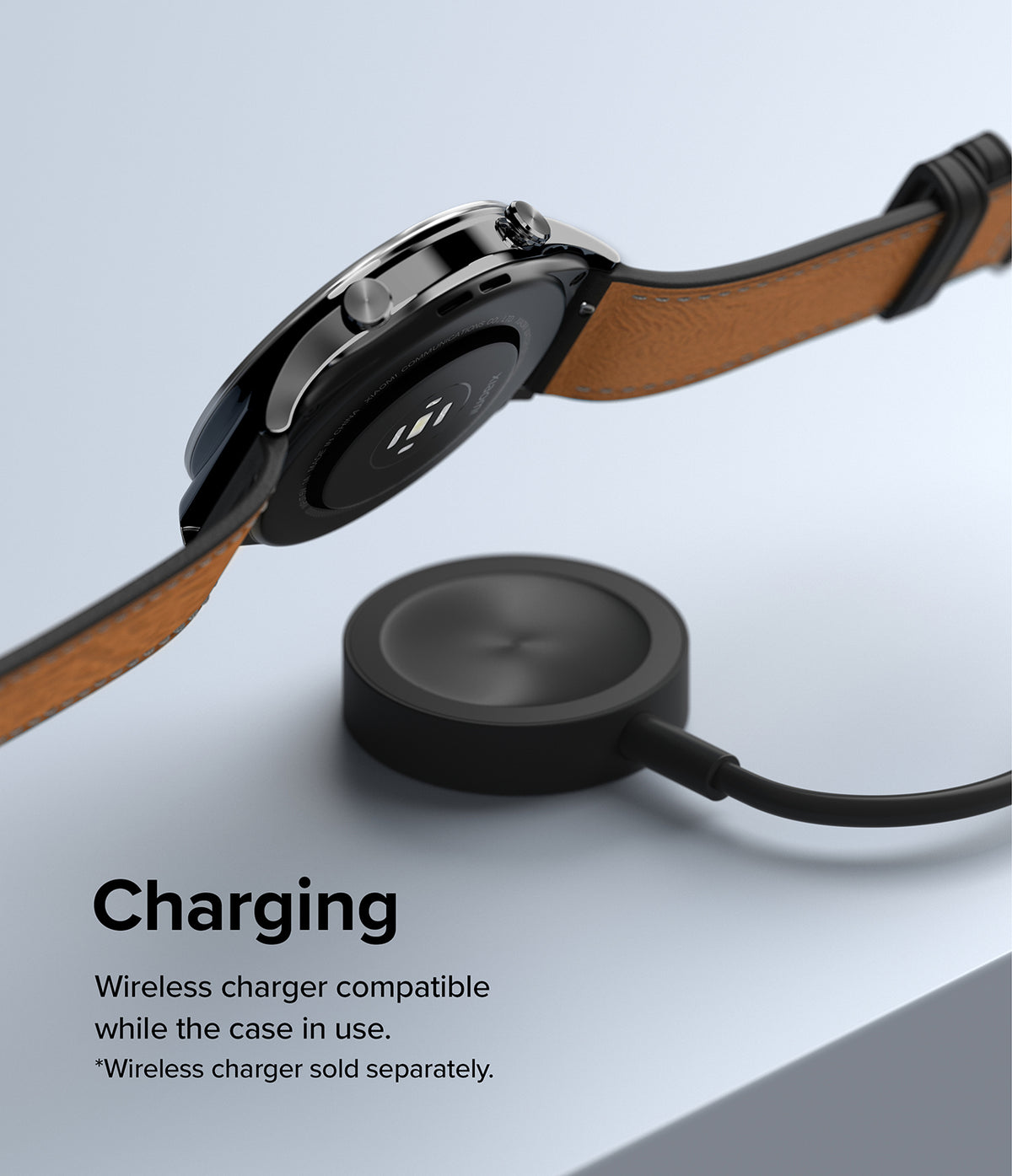 Xiaomi Watch S1 (46mm) 46-01 (ST) Silver - Silver smartwatch with brown leather strap hovering above a wireless charger.