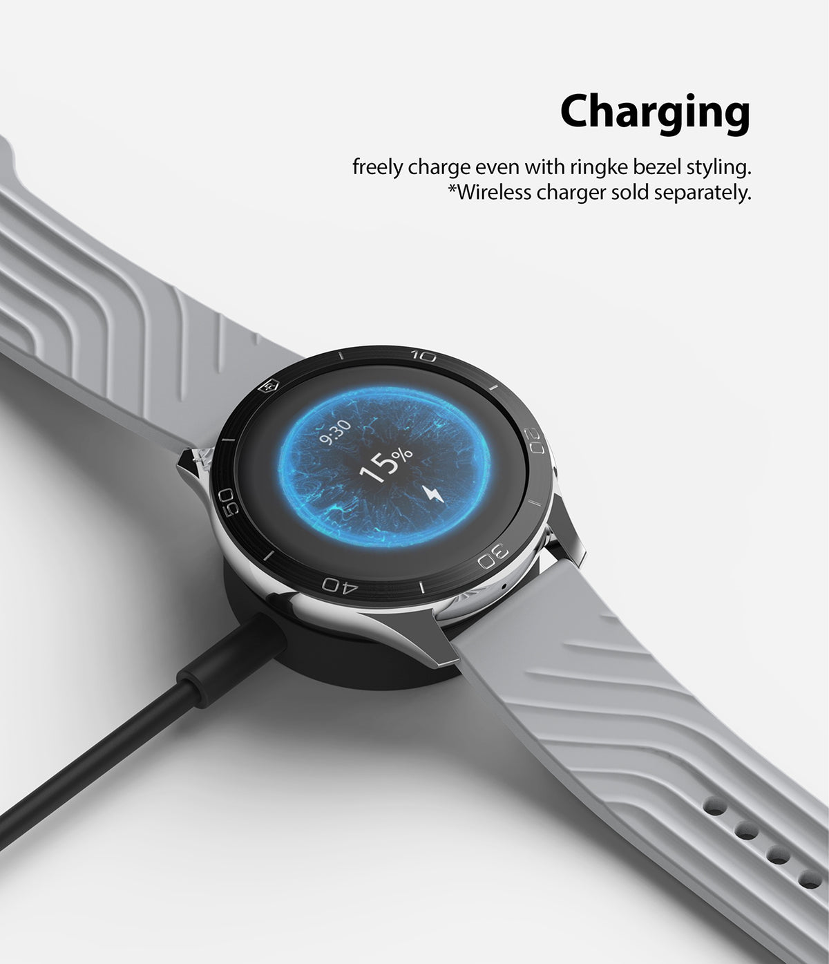 OnePlus Watch 46mm | Bezel Styling 46-02 - Smartwatch with black bezel styling charging on a wireless dock.