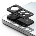 Redmi Note 11 Pro / 11 Pro 5G | Camera Styling - Black protective camera lens cover hovering above a smartphone camera module.