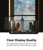 Redmi Note 11 / 11S Screen Protector [2P] | Invisible Defender - Redmi Note 11 / 11S Screen Protector - Transparent glass overlaying a smartphone screen displaying a city skyline video.