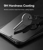 Redmi Note 11 / 11S Screen Protector [2P] | Invisible Defender - Redmi Note 11 / 11S Screen Protector - A metal key resting on a smartphone screen protector, demonstrating 9H scratch resistance.