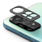 Redmi Note 11 | Camera Styling - A black protective camera lens cover hovering above the Redmi Note 11 camera module.
