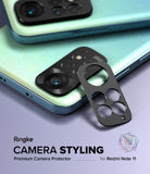 Redmi Note 11 | Camera Styling - Black metal camera lens protector frame being applied to a sparkly light blue smartphone.