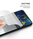 LG V50 ThinQ Screen Protector | Dual Easy Film - LG V50 ThinQ Screen Protector - Hand applying a clear screen protector film to an LG V50 smartphone screen.