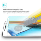 Moto G4 Screen Protector | Glass - Moto G4 Screen Protector - A utility knife blade scrapes against a tempered glass screen protector on a smartphone.