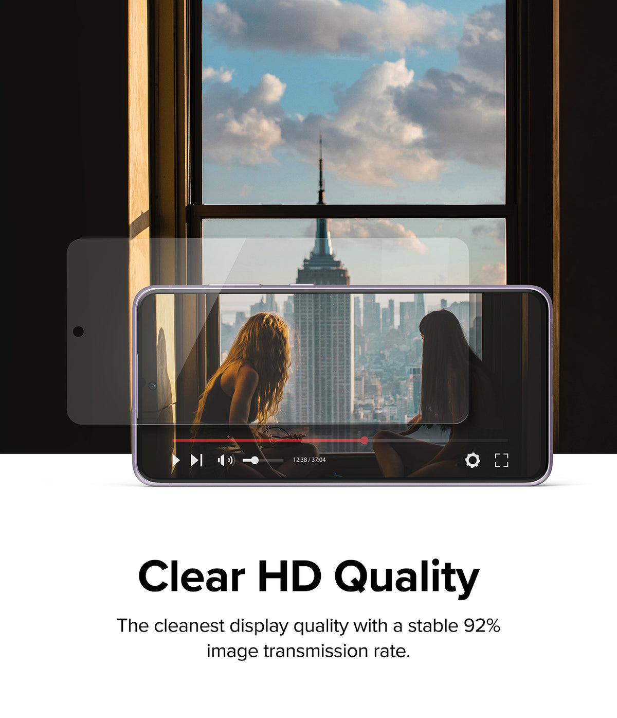 Galaxy S21 FE Screen Protector | Invisible Defender Glass - Galaxy S21 FE Screen Protector - Transparent glass overlaying a smartphone screen showing a clear city skyline video.