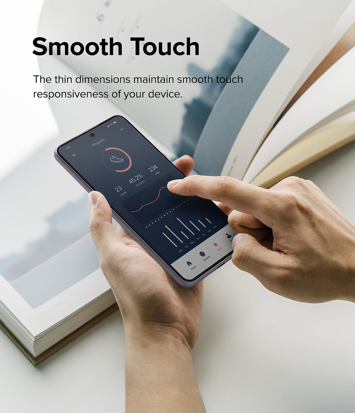Galaxy S21 FE Screen Protector | Invisible Defender Glass - Galaxy S21 FE Screen Protector - Hands touching a smartphone screen displaying a fitness app interface over an open book.