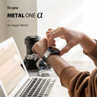 Apple Watch 49·46·45·44·42 mm | Metal One Band α - Silver - Person adjusting a silver metal watch band on their wrist.