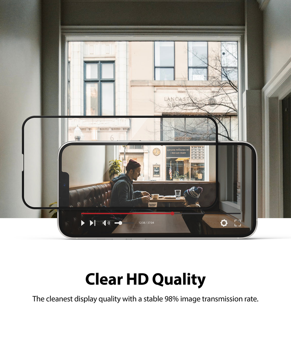 iPhone 13 Mini Screen Protector | Invisible Defender Glass - iPhone 13 Mini Screen Protector - A clear glass screen protector hovering over an iPhone 13 Mini displaying a video.